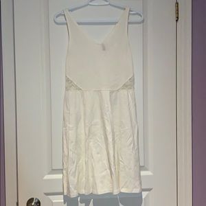 White skater dress with lace back and cut-outs